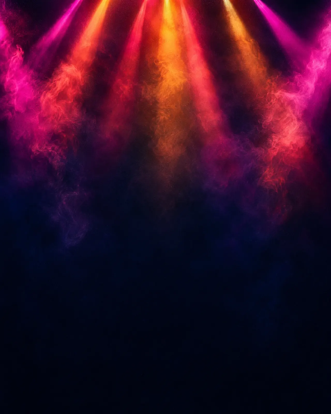 Laser beams cutting through haze above the dance floor